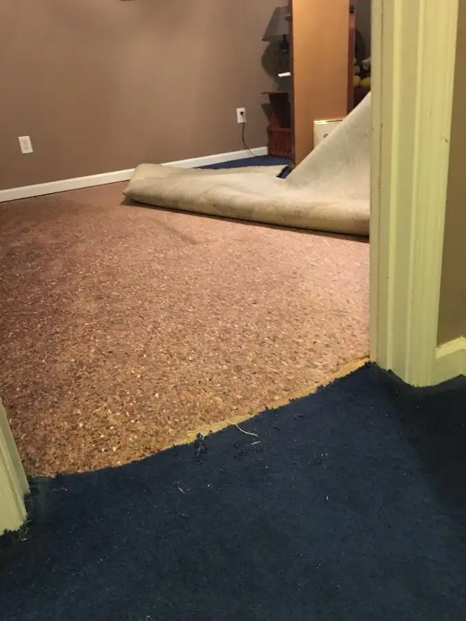 Carpet pad removal revealing water damage during Drying & Dehumidification in Haiku-Pauwela